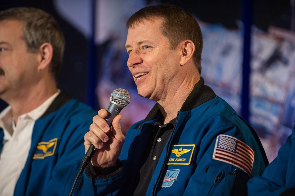Astronaut Greg Johnson, center, addresses the audience.