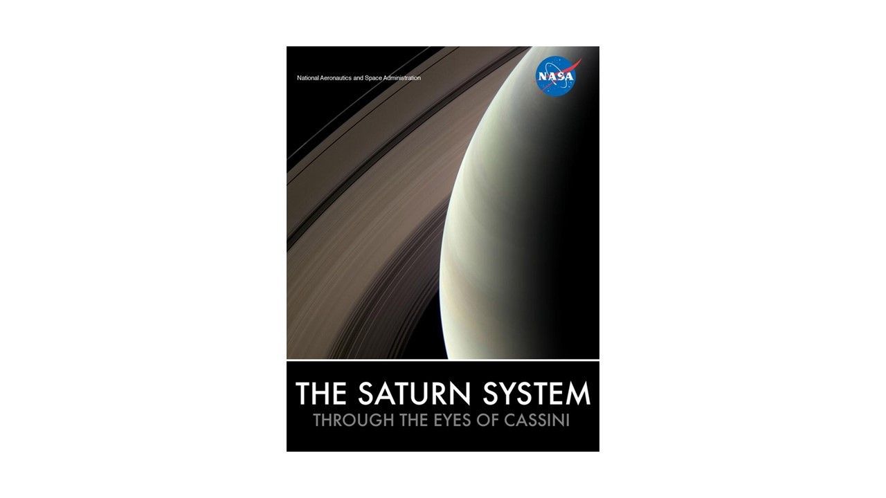 An image of Saturn fills the view. Saturn fills the right side of the image while its rings arch across the left side of the image. "The Saturn System: Through the Eyes of Cassini" is displayed at the bottom of the image. NASA's meatball logo is in the upper-right corner of the image. "