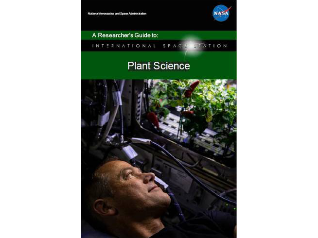 NASA astronaut and Crew-3 member Tom Marshburn looks at chiles growing inside of the Advanced Plant Habitat. Crew-3 performed the second harvest of chiles aboard the ISS for the Plant Habitat-04 experiment.