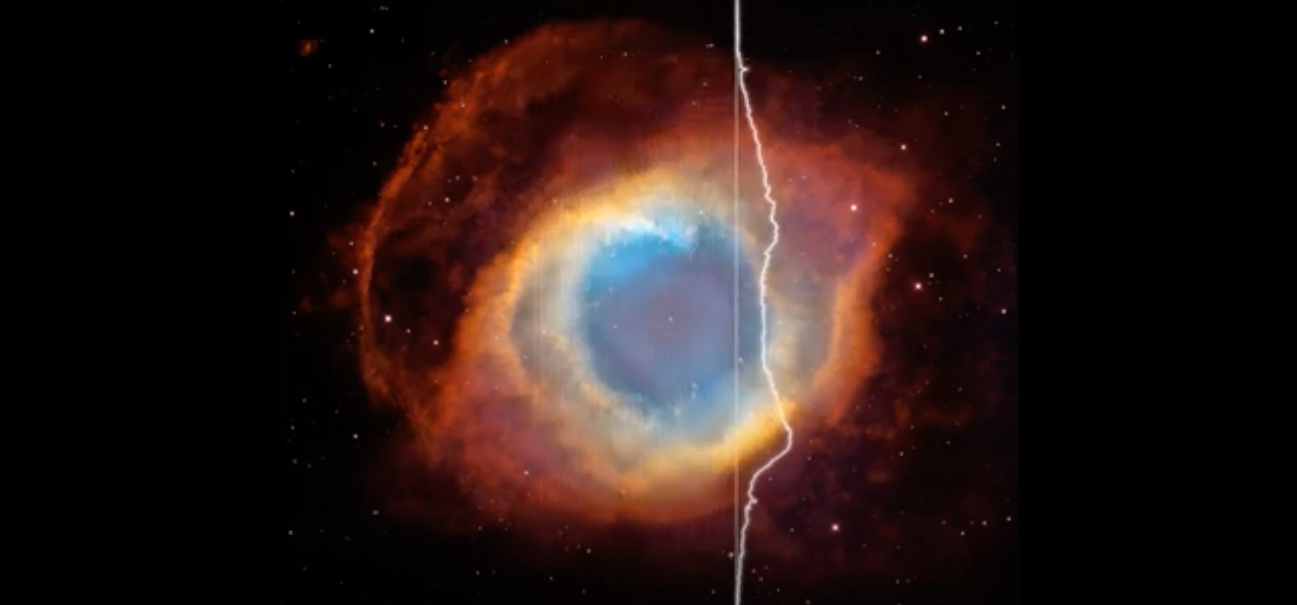 A sphere of blues, oranges, reds and whites at the center with a jagged white line running vertically down
