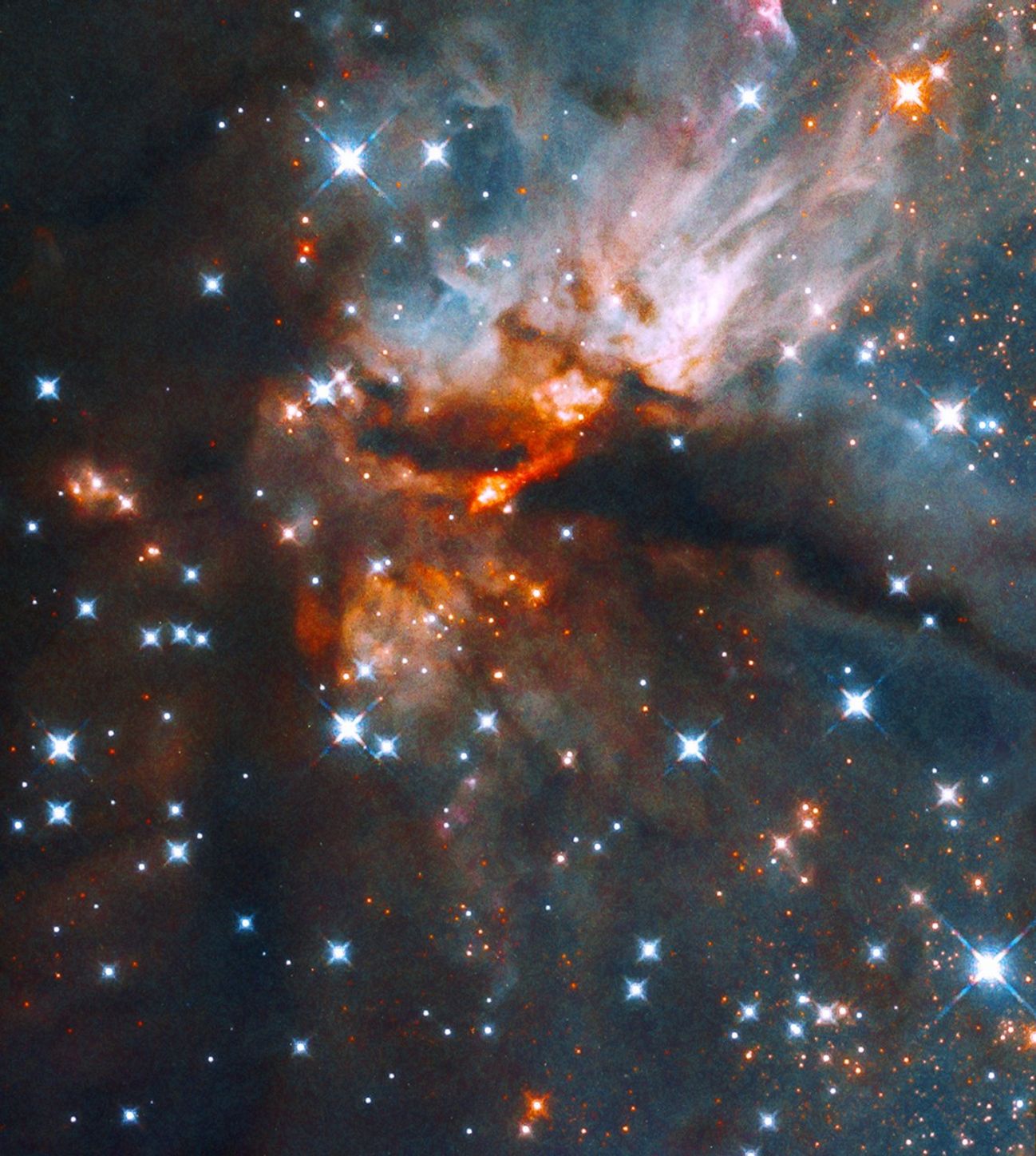 Blue and white, orange-red nebula bisected by a dark nebula, image is dotted with blue-white stars.