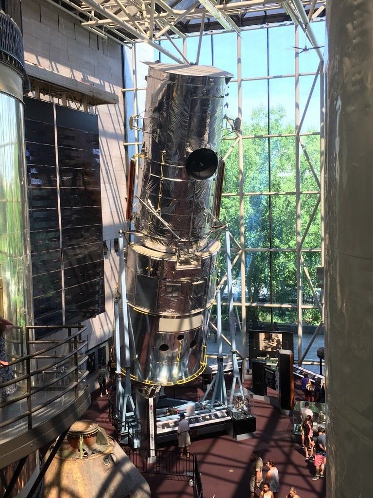 A photo, taken from the second floor, of the life-size model of the Hubble Space Telescope at the Smithsonian National Air and Space Museum in Washington, DC.