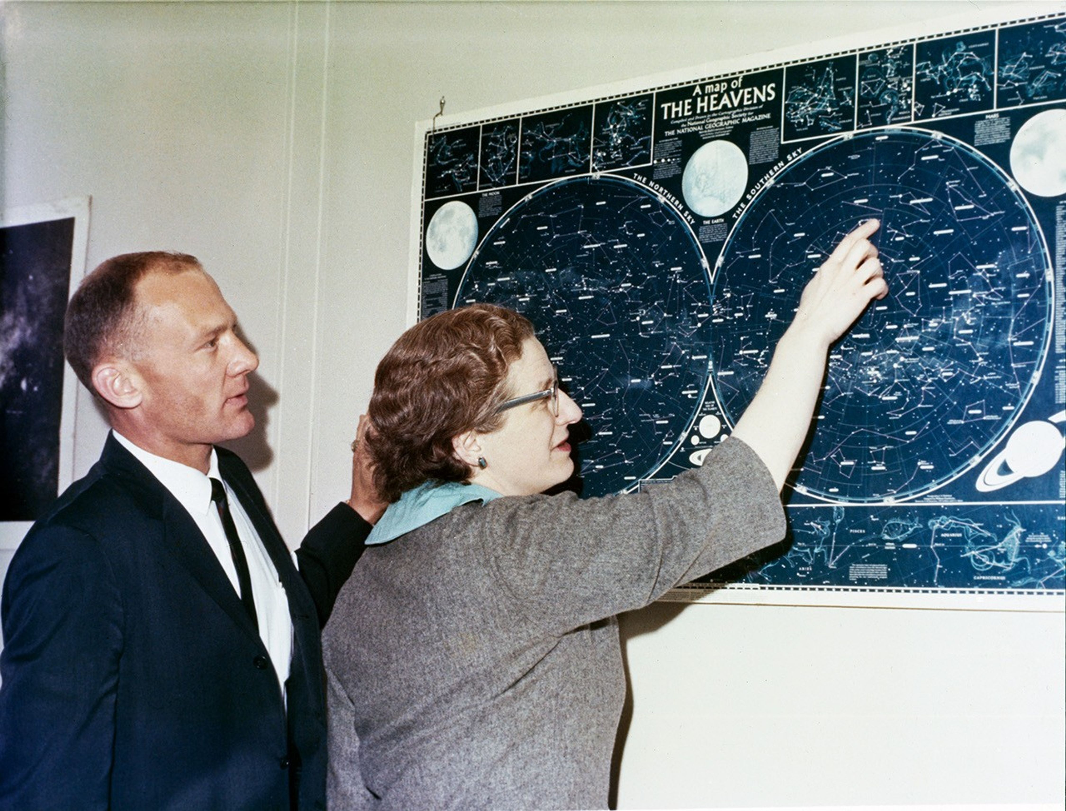 Dr. Nancy G. Roman, Chief Astronomy Program National Aeronautics and Space Administration’s Physics and Astronomy Program Office, briefs Edwin Aldrin on celestial bodies.