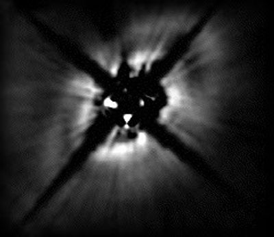 Gap in Stellar Dust Disk May Be Swept Out By Planet