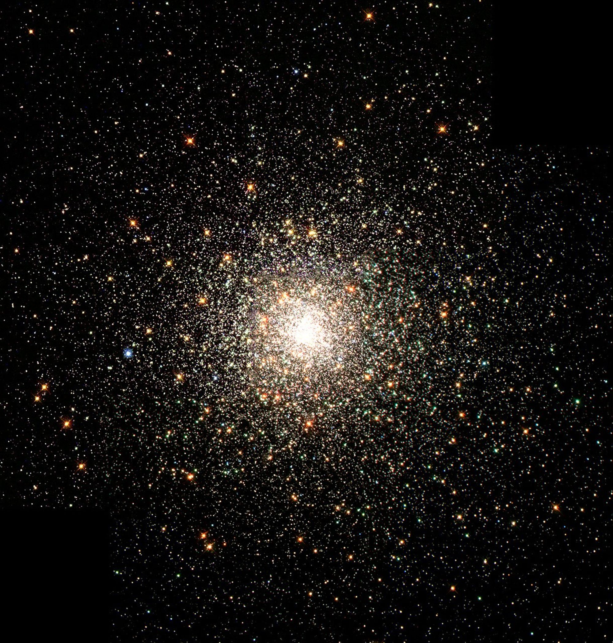 A bright white cluster of thousands of densely packed stars.