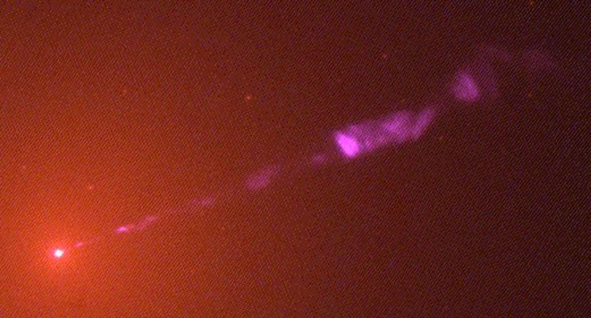 Black Hole in Galaxy M87 Emits Jet of High-Speed Electrons