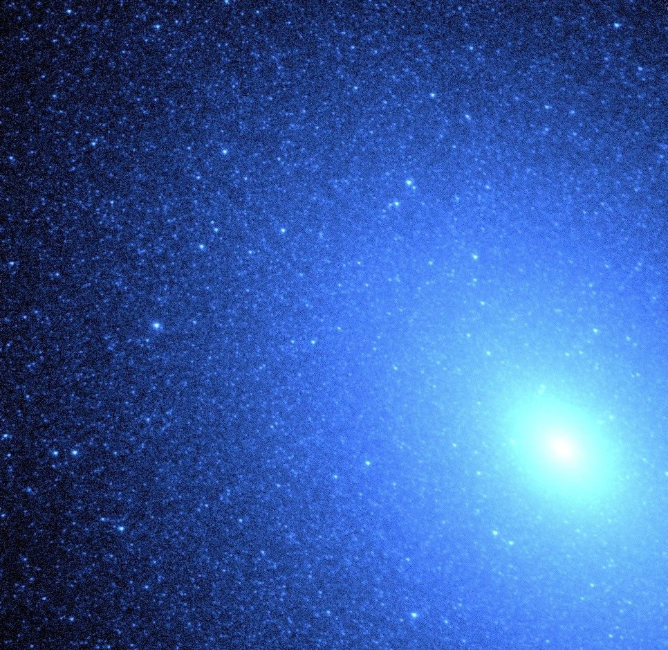 Hot Blue Stars Resemble a Blizzard of Snowflakes Near Core of Galaxy M32