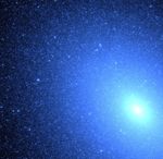 Hot Blue Stars Resemble a Blizzard of Snowflakes Near Core of Galaxy M32
