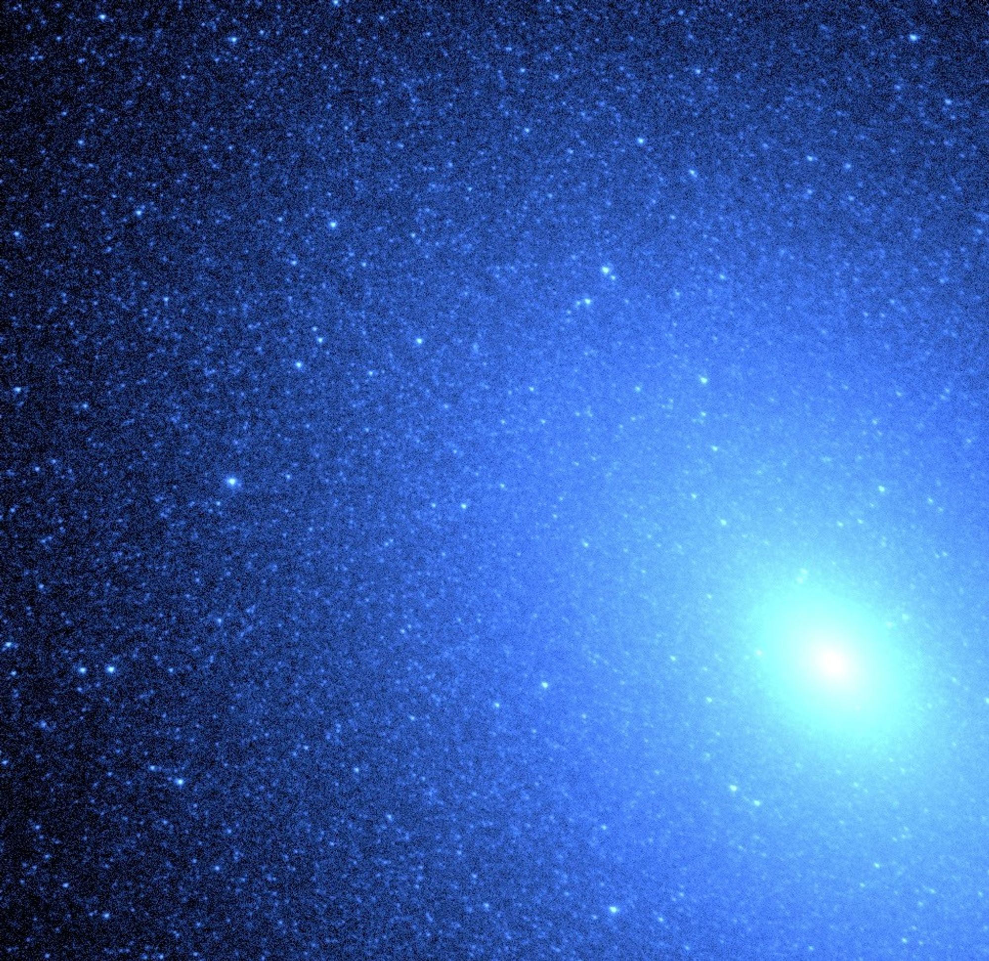 Hot Blue Stars Resemble a Blizzard of Snowflakes Near Core of Galaxy M32