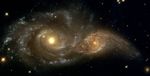 A Grazing Encounter Between Two Spiral Galaxies (NGC 2207 and IC2163)