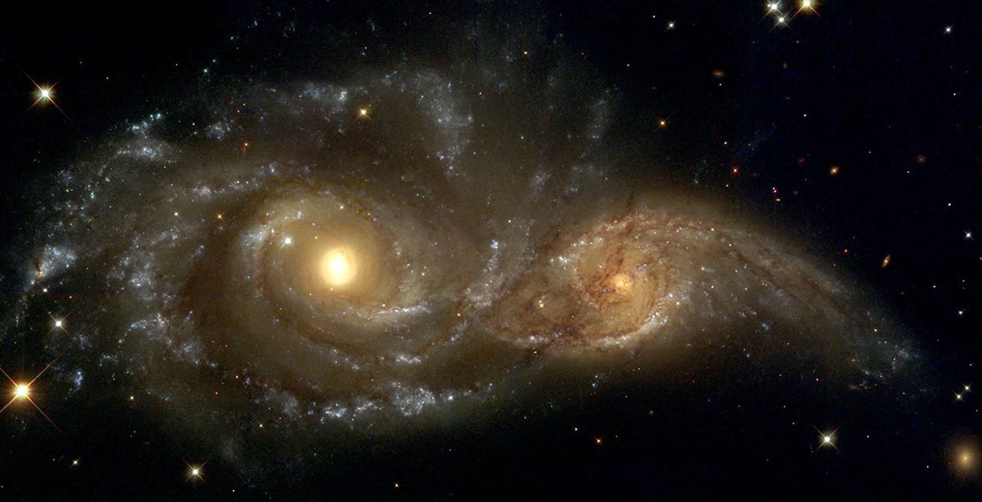 A Grazing Encounter Between Two Spiral Galaxies (NGC 2207 and IC2163)