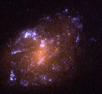A Tiny, Youthful Spiral Galaxy, ESO 418-008