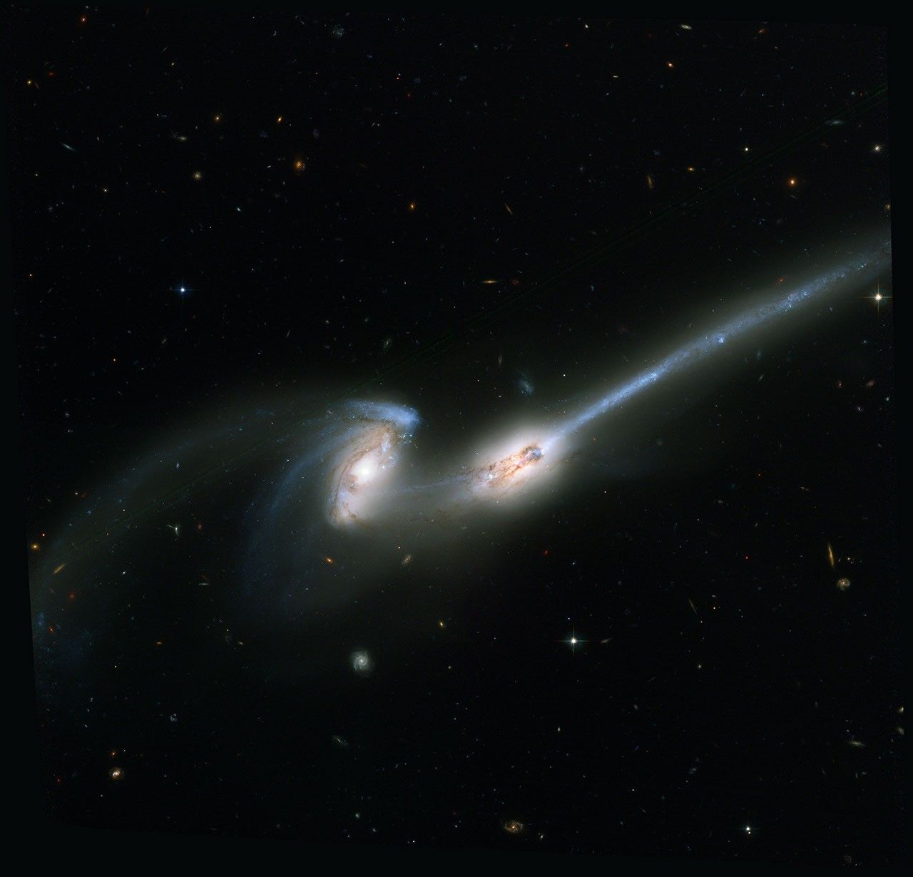 "The Mice" (NGC 4676): Colliding Galaxies Stream Stars and Gas