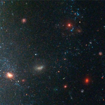 Star Clusters and Distant, Red Galaxies Near Edge of Galaxy NGC 3370