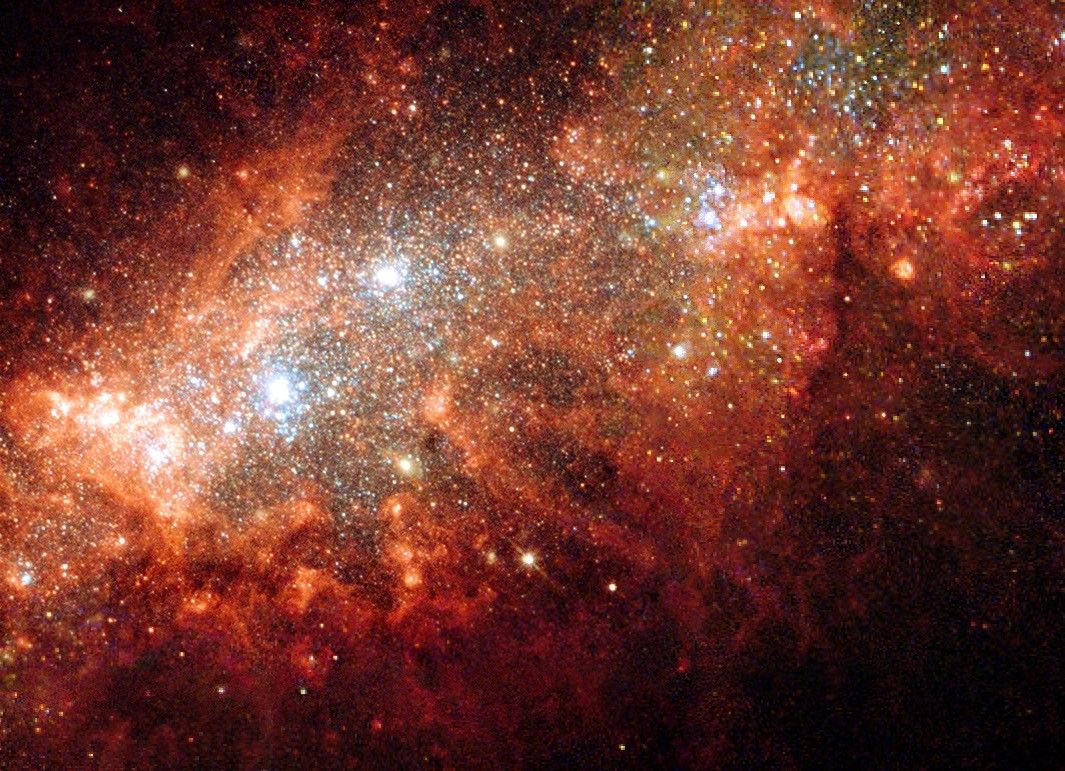 Stars of various colors, with many appearing orange, extend from bottom left to top right, and take up the majority of the view.