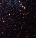 Reddish Arcs Mark Trail of Small Asteroid