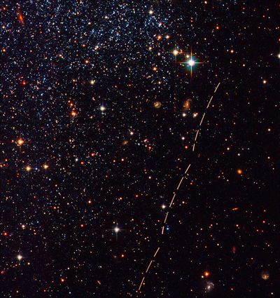 Reddish Arcs Mark Trail of Small Asteroid