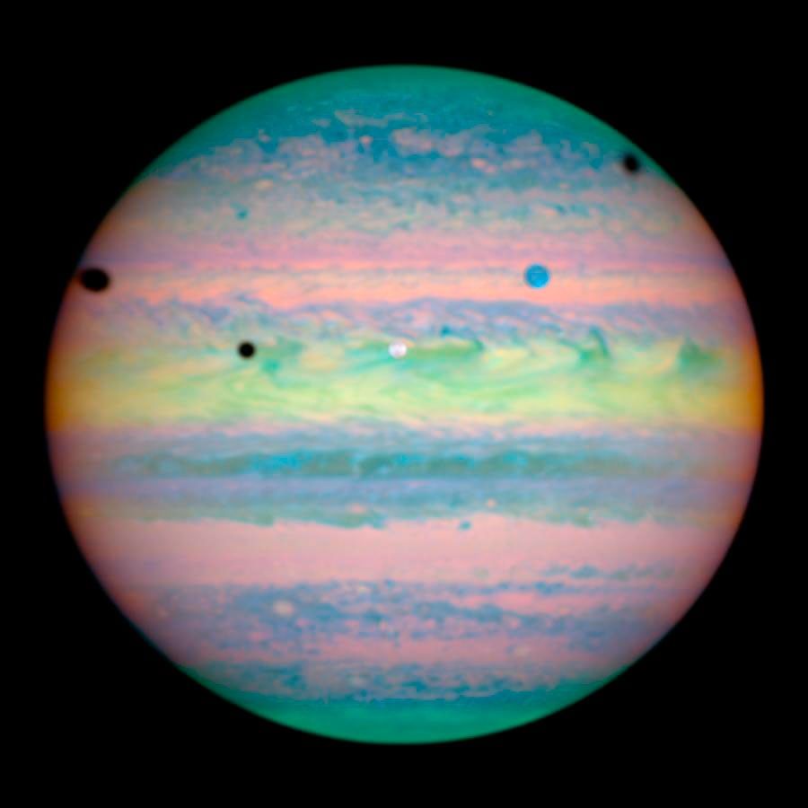Three Moons Cast Shadows on Jupiter