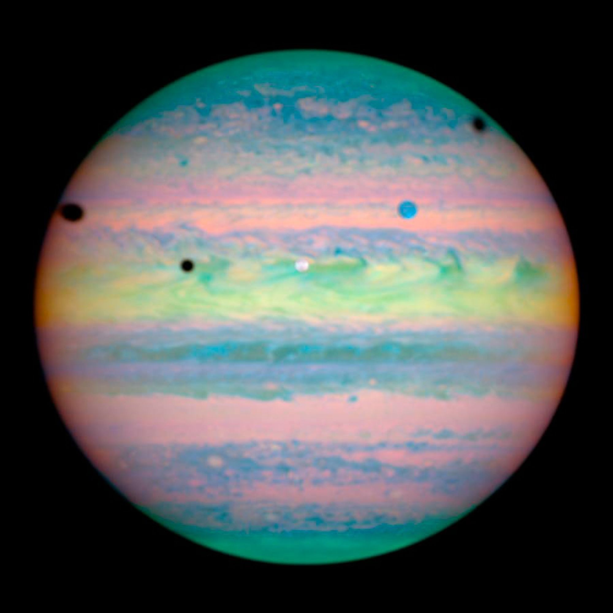 Three Moons Cast Shadows on Jupiter