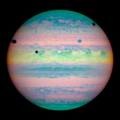Three Moons Cast Shadows on Jupiter