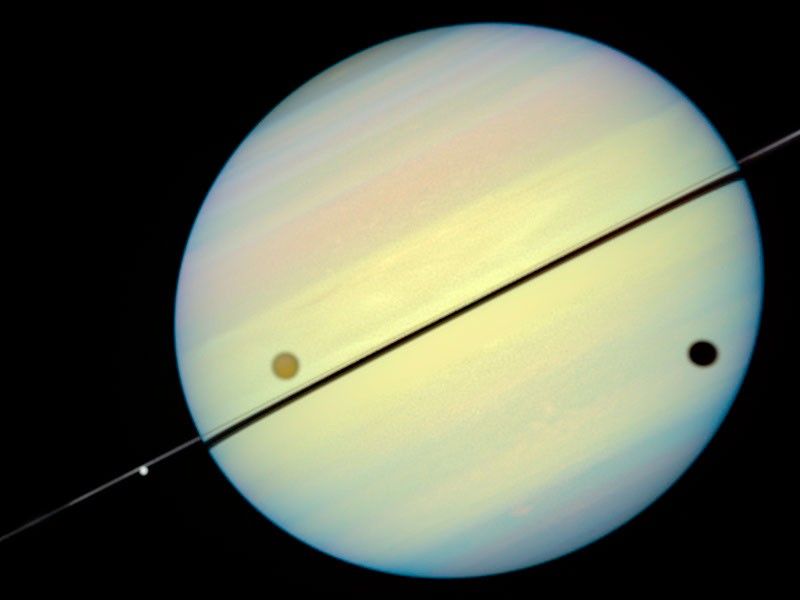 Hubble Catches Titan Chasing Its Shadow - Frame 1