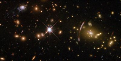 Hubble Sees ‘Comet Galaxy’ Being Ripped Apart By Galaxy Cluster