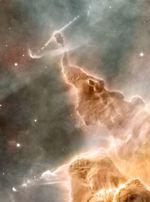 Strange-looking formations of gas and dust, eroded away by stellar winds and silhouetted by unseen stars, including an eroded pillar, has an almost reptilian appearance, with a body and thin neck, topped by a rounder head.