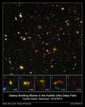 Hubble and Spitzer Uncover Smallest Galaxy Building Blocks