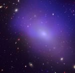 A sheer purple blob takes up the majority of the image, angled from top left to bottom right. The background is littered with small galaxies, some closer and others in the far distance.