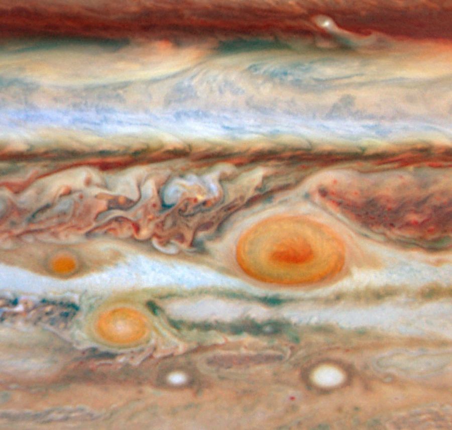 A close-up view of Jupiter’s southern hemisphere. The Great Red Spot is shown on the right side. To the direct left of it is a much smaller red spot. To the lower left of the Great Red Spot is Red Spot Jr., which is smaller than the Great Red Spot.