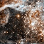 A dense cluster of bright yellow-white stars surrounded by fluffy brown and white material.