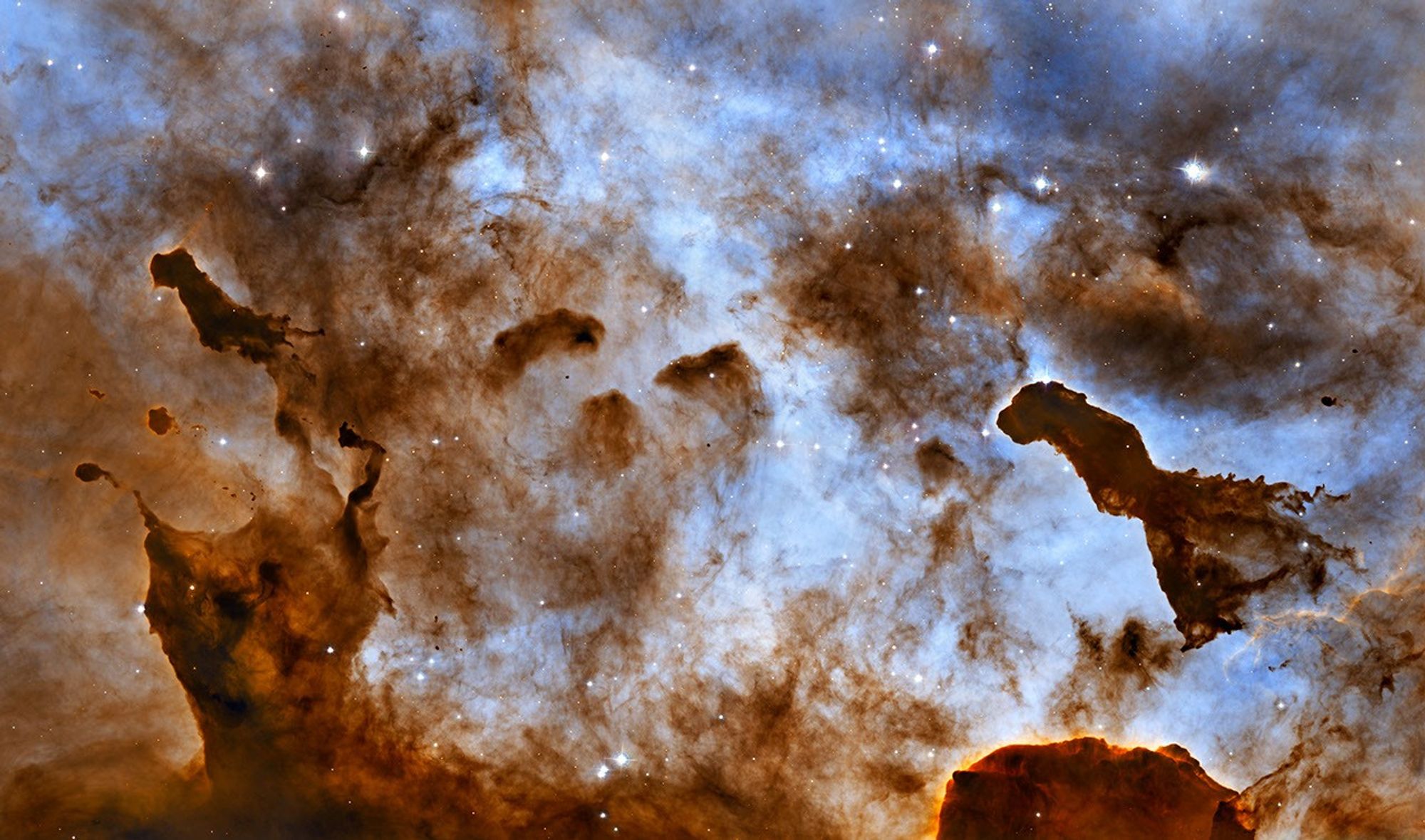 Cosmic Ice Sculptures: Dust Pillars in the Carina Nebula