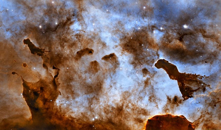Cosmic Ice Sculptures: Dust Pillars in the Carina Nebula