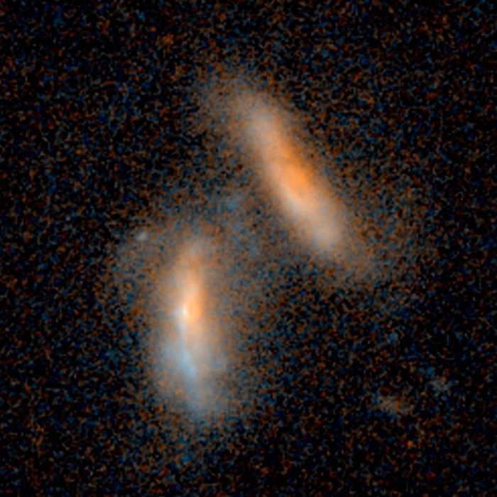 Merging Galaxies - 2.4 Billion Light-Years from Earth