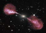 Small yellow elliptical galaxy with enormous pink jets projecting out in opposite directions, far into space.