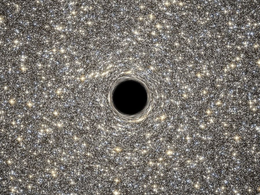 Artist's Concept of Giant Black Hole in Center of Ultracompact Galaxy