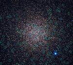 A detailed view of a globular cluster overlaid with light green circles, which mark the locations of white dwarf stars.