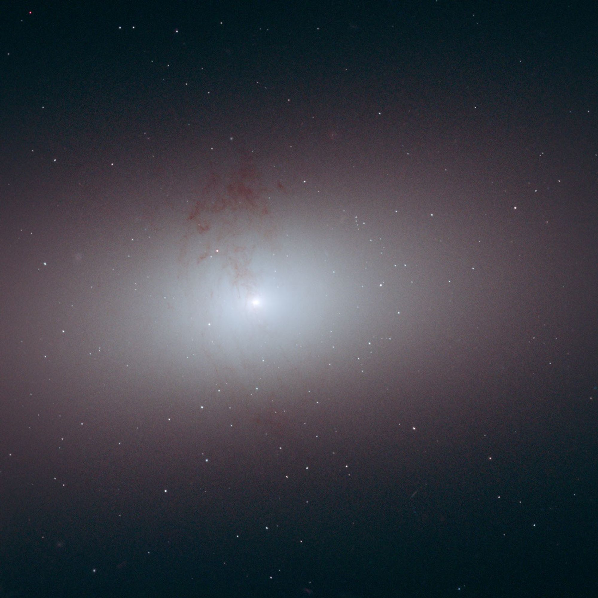 The smooth elliptical galaxy takes up a little more than a third of the frame.