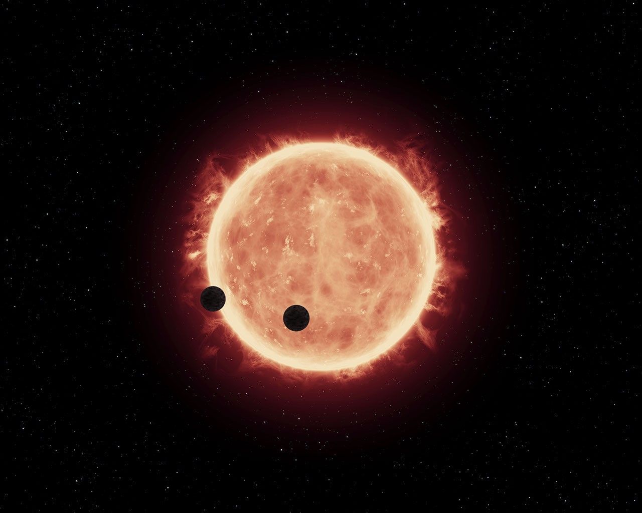 Artist's View of Planets Transiting Red Dwarf Star in TRAPPIST-1 System