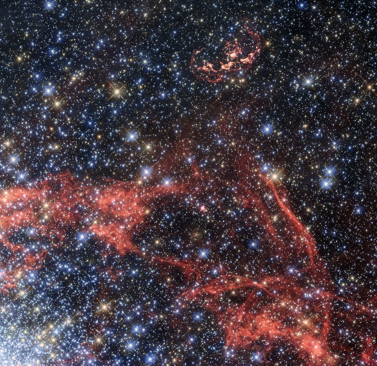 Bright red lines surround a star-filled area set against the black backdrop of space.