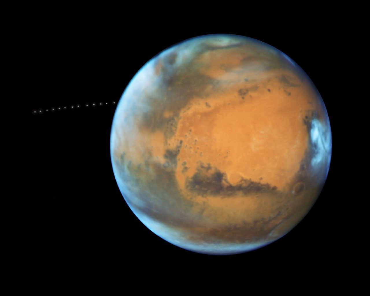 NASA’s Hubble Sees Martian Moon Orbiting the Red Planet