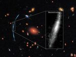 Hubble Pushed Beyond Limits to Spot Clumps of New Stars in Distant Galaxy