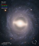 Image titled “NGC 1015, HST WFC3” with compass arrows, scale bar, color key, and labels.