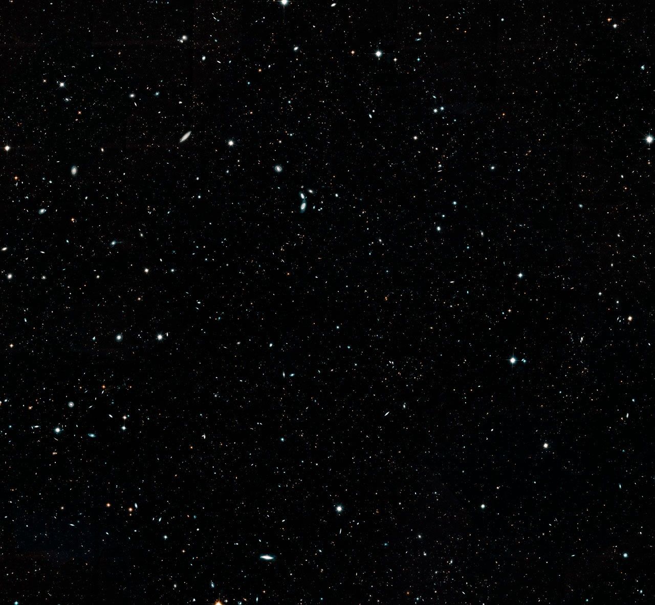 The background is black, but there are hundreds of thousands of tiny shapes scattered all across the scene.