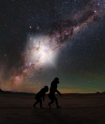 Hominids Walking Under Milky Way Flare