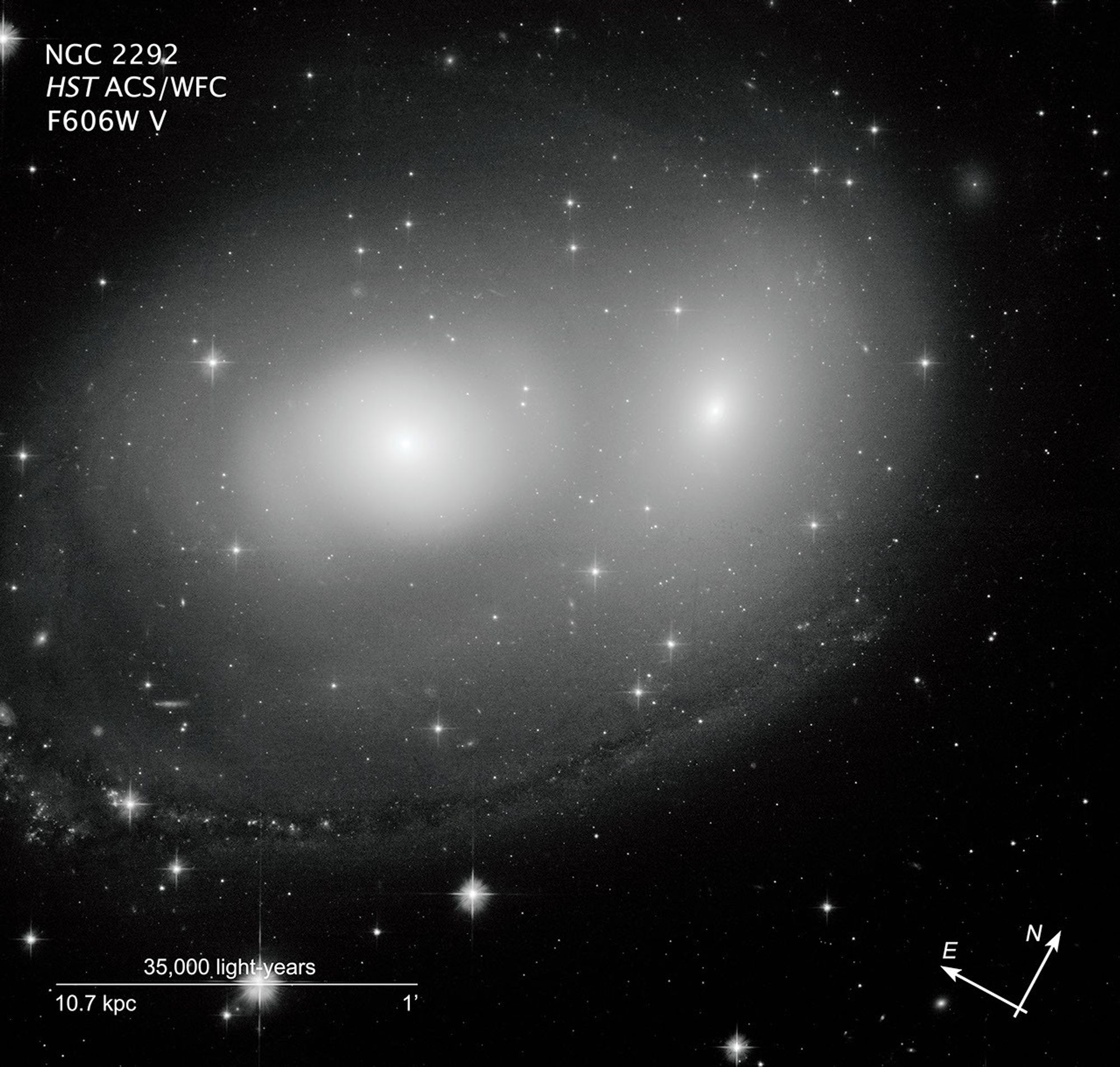 Interacting galaxies NGC 2292 and NGC 2293 with compass and scale