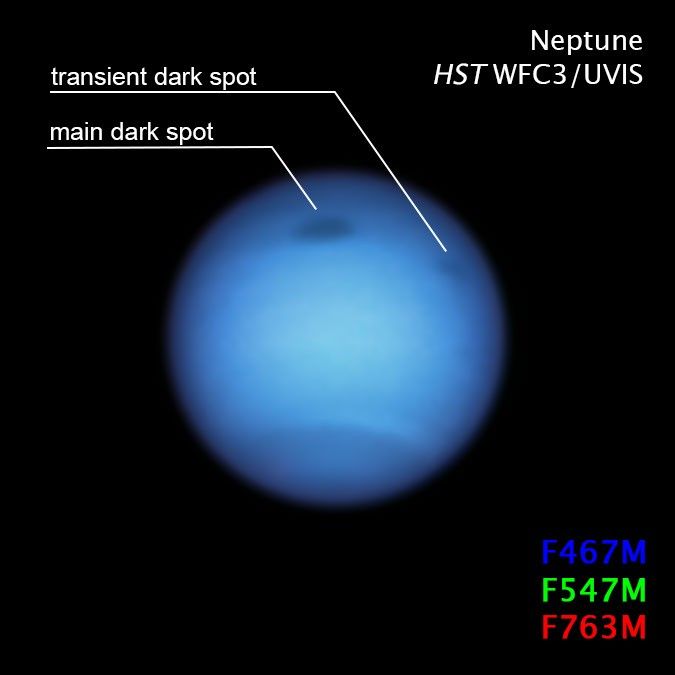 Dark spot on Neptune with Compass