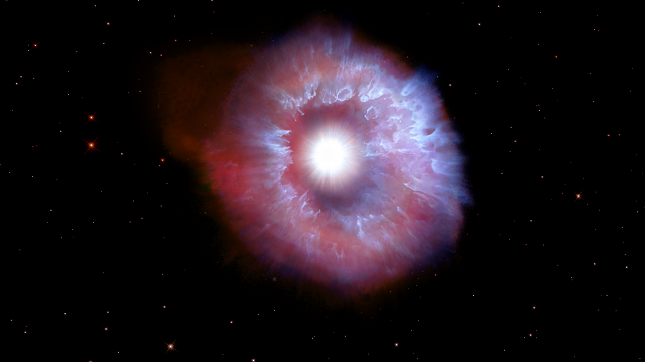 Bright star surrounded by shell of gas and dust