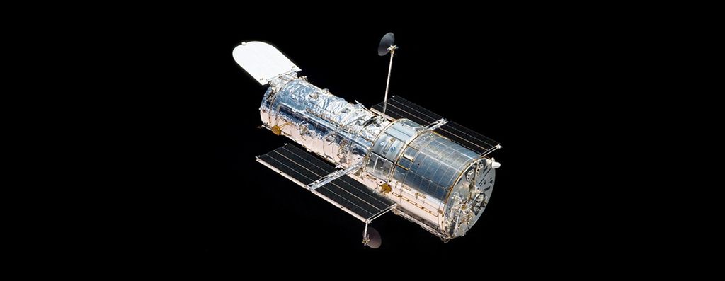 Hubble Space Telescope floats against the background of space