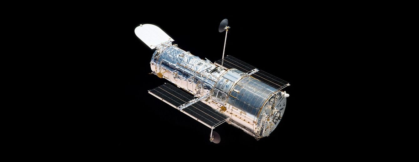 Hubble Space Telescope floats against the background of space